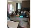 Interior shot of living room showing clutter and an outdated fireplace at 3150 W 134Th Ave, Broomfield, CO 80020