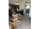 Interior shot of the living room filled with an abundance of clutter and old furniture at 3150 W 134Th Ave, Broomfield, CO 80020