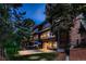 Backyard featuring outdoor seating, hot tub, large glass windows, and an outdoor grill at 9658 Coronado Ct, Parker, CO 80134