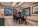 Elegant dining room with bay windows and stylish chandelier at 9658 Coronado Ct, Parker, CO 80134