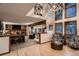 Bright living room with high ceilings, brick fireplace, and multiple seating areas at 9658 Coronado Ct, Parker, CO 80134