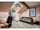 Cozy living space with gray sofa, modern light fixture, and view from the window at 9658 Coronado Ct, Parker, CO 80134