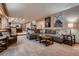 Spacious living room with a large sectional couch and open access to the kitchen at 9658 Coronado Ct, Parker, CO 80134