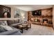 Comfortable living area featuring a brick fireplace and built-in shelving at 9658 Coronado Ct, Parker, CO 80134