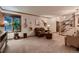 Spacious living room with a large window, comfortable seating, hardwood trim and a staircase at 9658 Coronado Ct, Parker, CO 80134