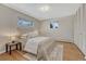 Bedroom with hardwood floors, natural light, and closet space at 3905 S Jersey St, Denver, CO 80237