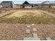 Expansive backyard featuring a split yard with rock bed and grass at 762 Penn Rd, Elizabeth, CO 80107