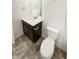 A bathroom featuring a toilet, vanity with sink, and modern fixtures at 762 Penn Rd, Elizabeth, CO 80107