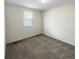 Bedroom featuring a neutral color palette, carpet, and natural light from the window at 762 Penn Rd, Elizabeth, CO 80107