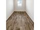 Bedroom features a window and light-colored laminate flooring at 762 Penn Rd, Elizabeth, CO 80107