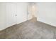 Minimalist bedroom with carpet and open door at 762 Penn Rd, Elizabeth, CO 80107