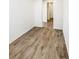 Empty room featuring light-colored laminate flooring and white walls at 762 Penn Rd, Elizabeth, CO 80107