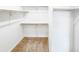 Walk-in closet with carpet and white shelving for organization at 762 Penn Rd, Elizabeth, CO 80107