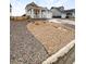 Attractive home featuring landscaped front yard, a covered porch, and a two-car garage at 762 Penn Rd, Elizabeth, CO 80107