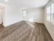 Living room with new light-colored laminate flooring and neutral walls at 762 Penn Rd, Elizabeth, CO 80107