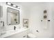 Updated bathroom with modern vanity and fixtures at 6714 Depew St, Arvada, CO 80003