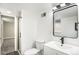 Basement bathroom with walk-in shower and modern vanity at 6714 Depew St, Arvada, CO 80003