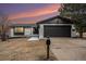 Updated Ranch home exterior boasts a fresh coat of paint and modern finishes at 6714 Depew St, Arvada, CO 80003