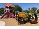 Playground with barn and tractor themed equipment at 6714 Depew St, Arvada, CO 80003