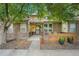 Charming brick home featuring a well-kept front yard, fence and inviting front porch at 9193 W 7Th Ave, Lakewood, CO 80215
