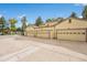 Three-car garage with light yellow doors and ample parking space at 9193 W 7Th Ave, Lakewood, CO 80215