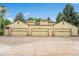 Three-car garage with light yellow doors and ample parking space at 9193 W 7Th Ave, Lakewood, CO 80215