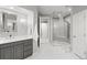 Bathroom with a double vanity, glass enclosed shower and a separate toilet room at 254 Lead Queen Dr, Castle Rock, CO 80108