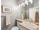 Modern bathroom with a sleek sink, framed mirror, and a shower with glass door, providing a clean aesthetic at 254 Lead Queen Dr, Castle Rock, CO 80108
