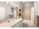 Well-lit bathroom featuring a tiled shower, vanity with ample counter space, and neutral color scheme at 254 Lead Queen Dr, Castle Rock, CO 80108