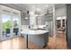 This is a spacious kitchen featuring gray cabinetry, stainless steel appliances, and a kitchen island at 254 Lead Queen Dr, Castle Rock, CO 80108