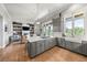 Open-concept kitchen with stainless steel appliances, an island, and an adjacent living area at 254 Lead Queen Dr, Castle Rock, CO 80108