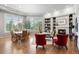 This is an open concept floor plan with a dining room, fireplace, and large windows at 254 Lead Queen Dr, Castle Rock, CO 80108