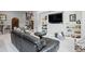 Comfortable living room features a plush black leather sofa, built-in bookshelves, and stylish decor at 254 Lead Queen Dr, Castle Rock, CO 80108