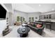 Finished basement with a TV and a large leather couch and chairs at 254 Lead Queen Dr, Castle Rock, CO 80108