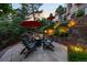Backyard seating around a fire pit with upscale landscaping, stone accents and waterfall feature at 254 Lead Queen Dr, Castle Rock, CO 80108