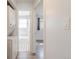 Bright bathroom view with decorative tile flooring and a full bathtub and shower at 1476 W Dakota Ave, Denver, CO 80223