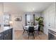 Cozy dining area with a round table, modern chairs, and ample natural light at 1476 W Dakota Ave, Denver, CO 80223