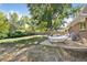 Backyard featuring a patio with a hammock, a grill and a leafy green tree at 2432 S Newport St, Denver, CO 80224