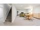 Finished basement showcasing a staircase, dining area, and cozy living space with recessed lighting at 2432 S Newport St, Denver, CO 80224