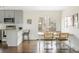 Modern dining room adjacent to kitchen with bright decor and patio access at 2432 S Newport St, Denver, CO 80224