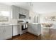 Well-equipped kitchen with stainless steel appliances and open layout to dining area at 2432 S Newport St, Denver, CO 80224