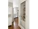 Walk-in pantry with glass door and custom shelving for organized storage at 2432 S Newport St, Denver, CO 80224