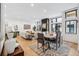 Bright dining room with hardwood floors and modern light fixture at 838 Ash St # 1, Denver, CO 80220