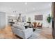 Living room with an open floor plan and view into modern kitchen at 838 Ash St # 1, Denver, CO 80220