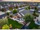 Aerial view of a home with a spacious backyard, patio, and lush landscaping at 3107 S Nepal Way, Aurora, CO 80013