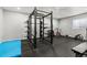 Home gym features a weight rack, stationary bike, free weights, and rubber flooring at 3107 S Nepal Way, Aurora, CO 80013