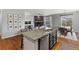 Open-concept kitchen island with granite countertops and seating for casual dining at 3107 S Nepal Way, Aurora, CO 80013