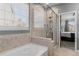 Bright bathroom with a tiled walk-in shower and separate soaking tub at 3107 S Nepal Way, Aurora, CO 80013