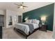 This main bedroom features plush carpet, modern ceiling fan, and ensuite bathroom with shower and soaking tub at 3107 S Nepal Way, Aurora, CO 80013