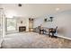Finished basement space showcasing a fireplace, built-in shelving and desk and egress window at 461 S Kalispell Way # D, Aurora, CO 80017